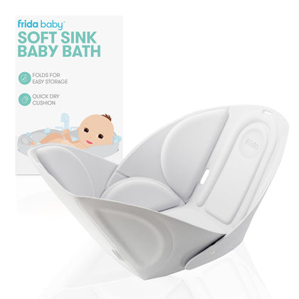 Frida Baby Soft Sink Baby Bath Seat | Sink Bather for Baby | Easy to Clean Baby Bathtub + Bath Cushion That Supports Baby's Head