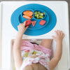 ezpz Mini Mat (Blue) - 100% Silicone Suction Plate with Built-in Placemat for Infants + Toddlers - First Foods + Self-Feeding - Comes with a Reusable Travel Bag - 6 Months+